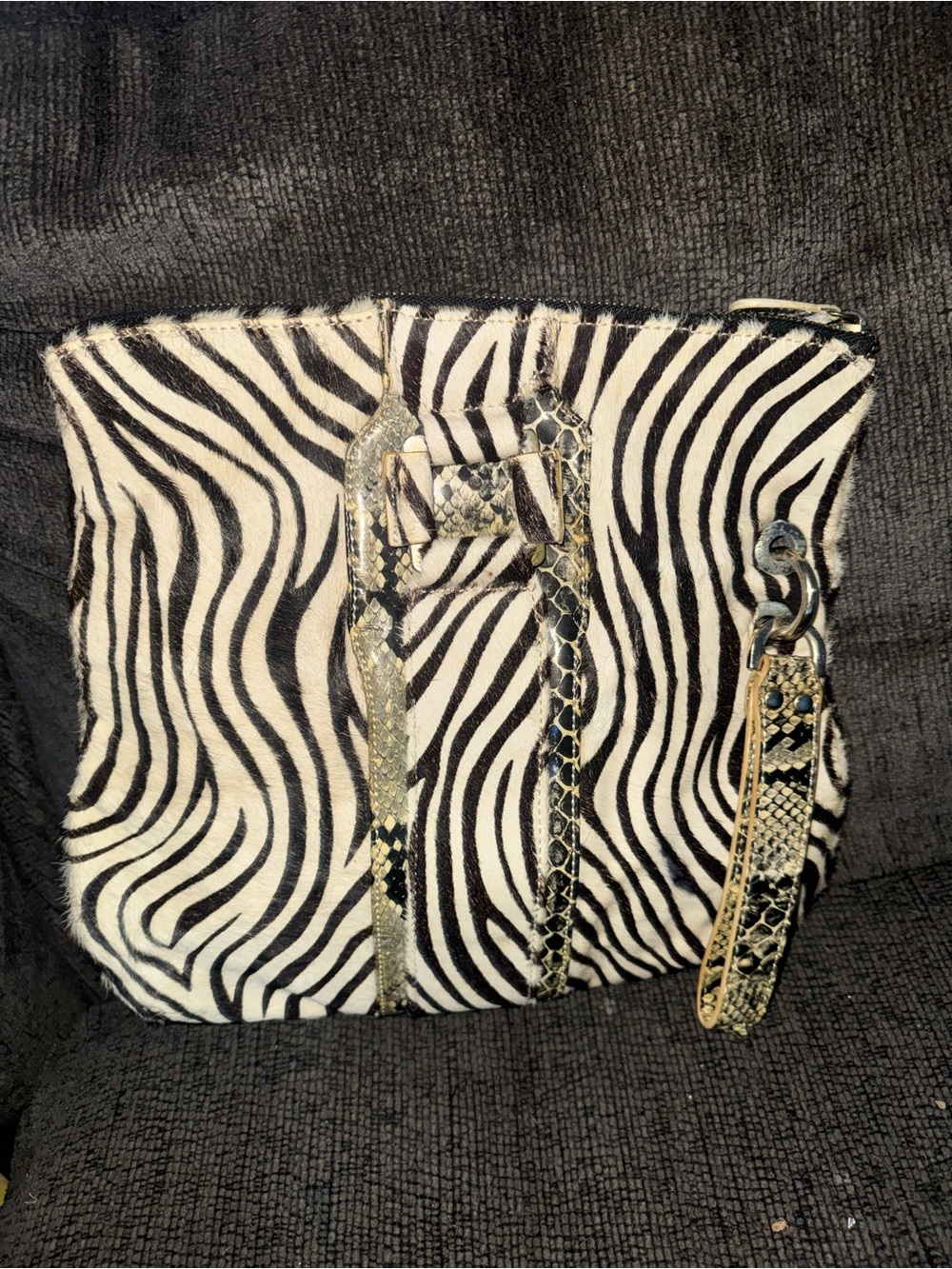 Authentic zebra hide wristlet bag with snake accents